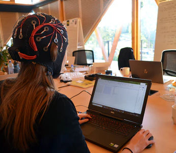 Participant wearing EMOTIV EPOC Flex 32-channel wireless EEG head cap system