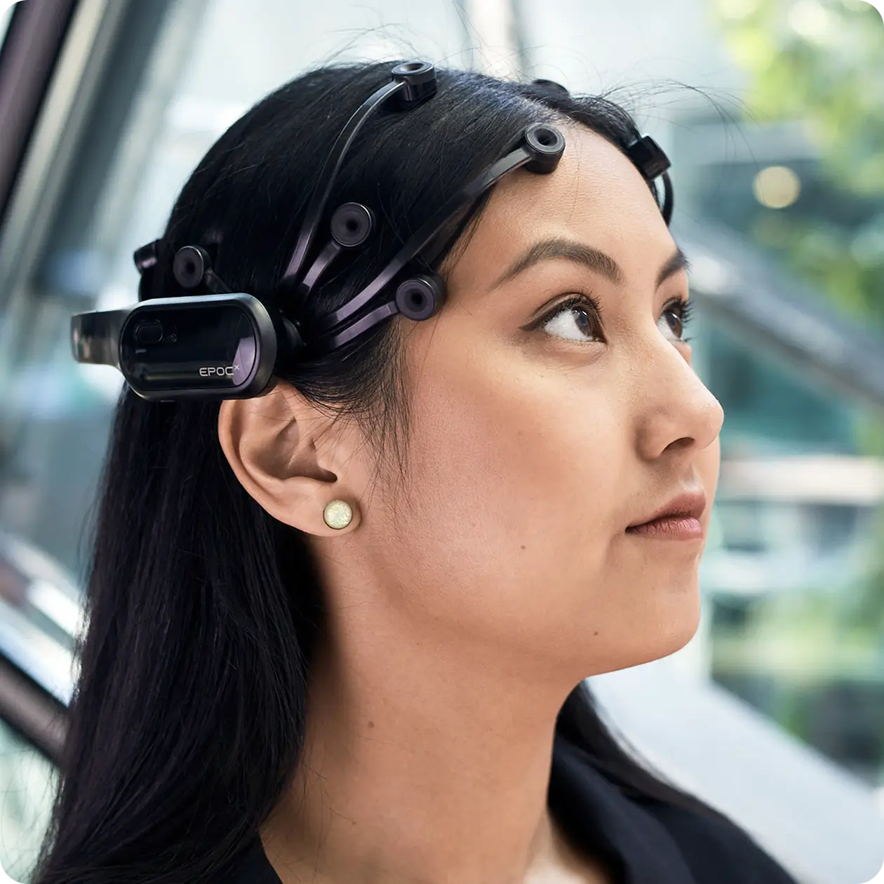 Woman wearing an Emotiv Epoc X